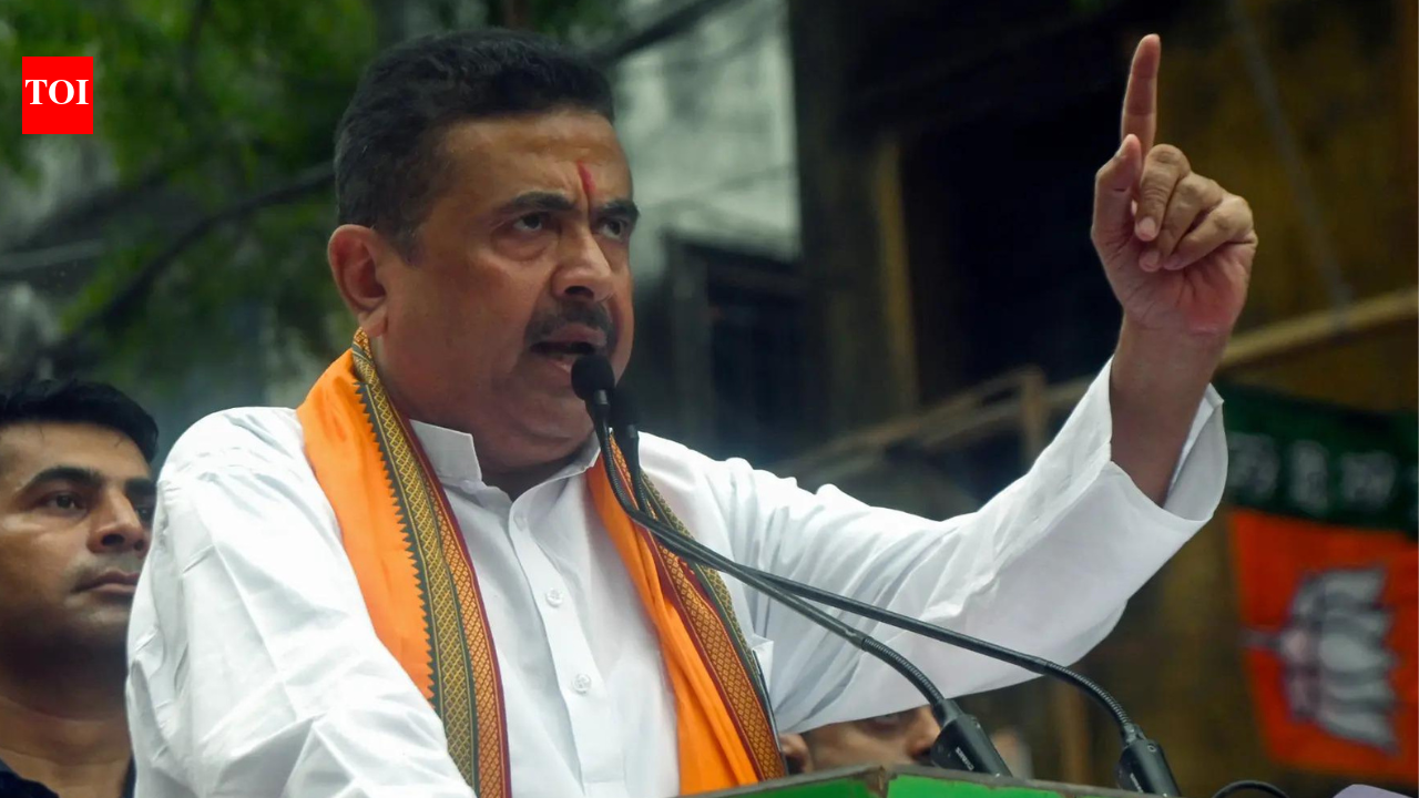 Voting heats up in Bengal: BJP’s Suvendu Adhikari shows flag to ‘contract workers’ during vote counting. india news