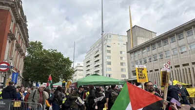 A man has been arrested after a van injured a pedestrian during a protest over the removal of flags in Birmingham