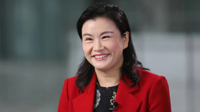 She once worked in a glass factory, now she runs a $26 billion company and sits with Elon Musk and Tim Cook at Chinese state dinners.